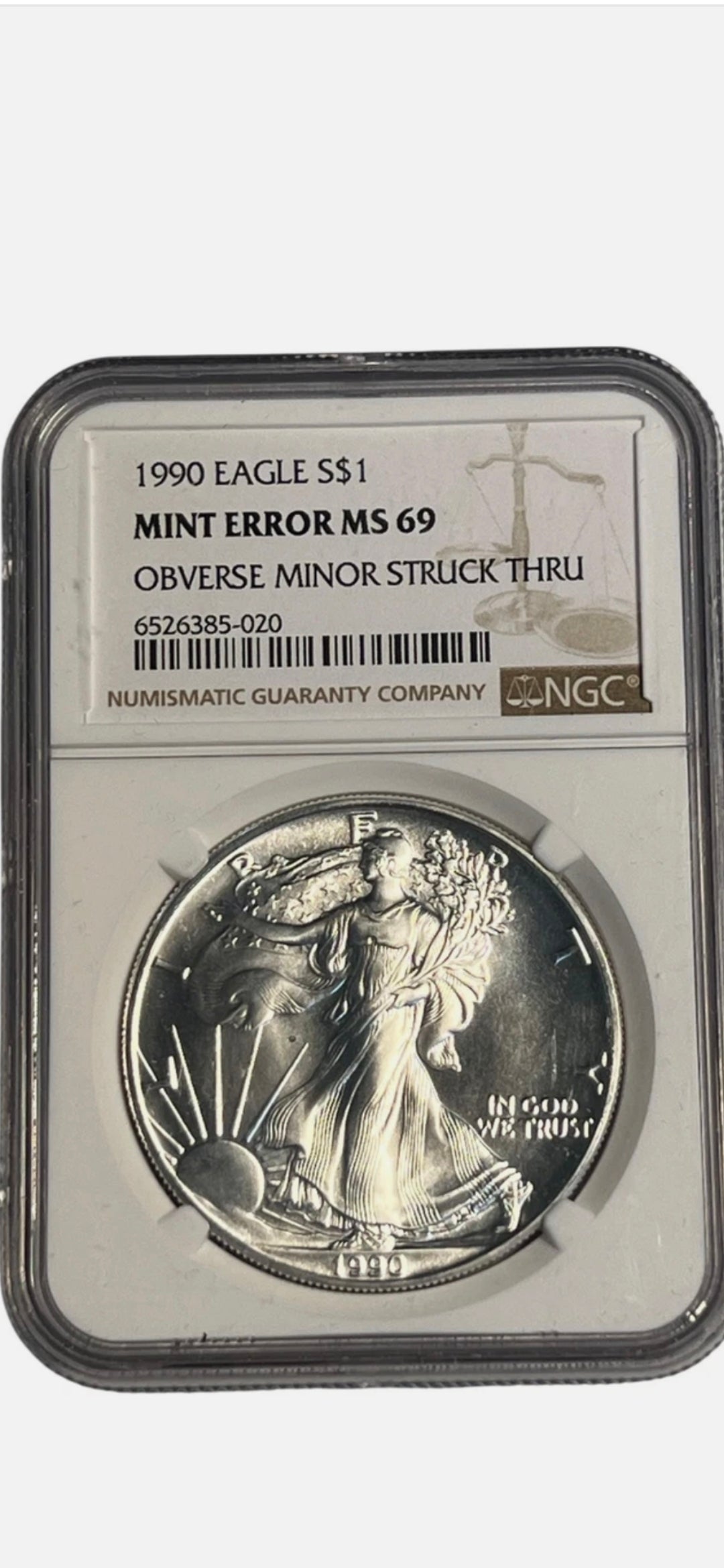 1990 $1 AMERICAN SILVER EAGLE MS69 MINT ERROR OBVERSE STRUCK THRU NGC